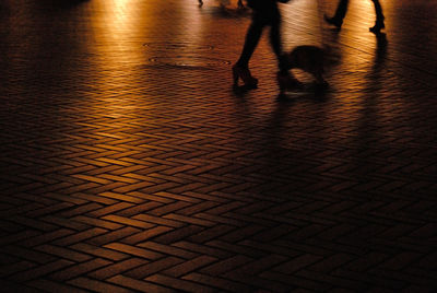 Low section of people walking on footpath