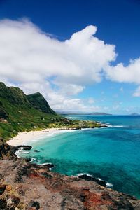 Scenic view of sea against cloudy sky