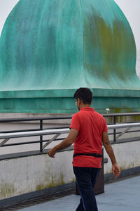 Rear view of boy walking