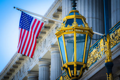 Vintage lamp with american flag outside san francisco city hall