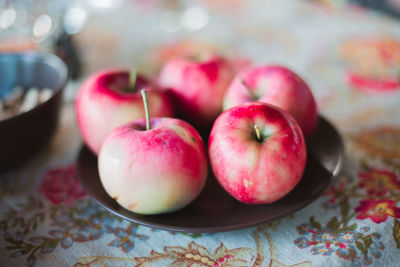 High angle view of apples in plate on table