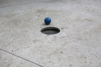 High angle view of ball by hole