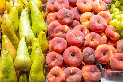 Pears and peaches for sale at a market