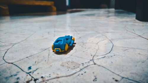 Close-up of toy car on floor