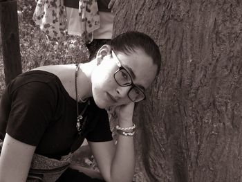 Portrait of young woman looking down