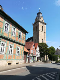 Low angle view of bell tower against sky