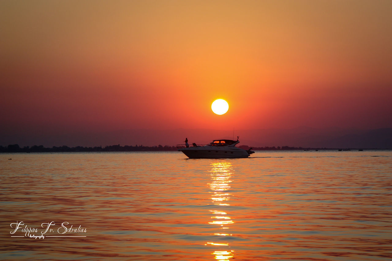 SILHOUETTE BOAT IN SEA AGAINST ORANGE SKY