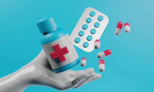 Close-up of pills against blue background