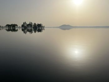 Scenic view of lake against sky during sunset