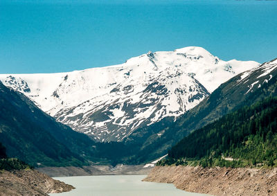 Scenic view of mountains against clear blue sky