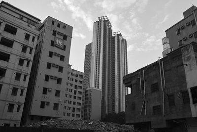 Low angle view of buildings in city against sky