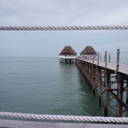 Pier over sea against sky