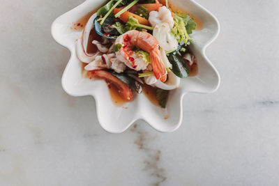 Directly above shot of salad in plate on table