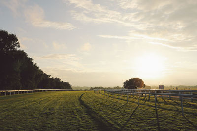 Epsom downs racecourse against sky during sunset