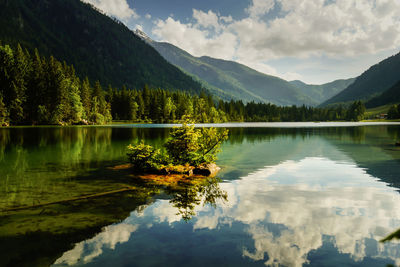 Scenic view of lake and mountains against sky