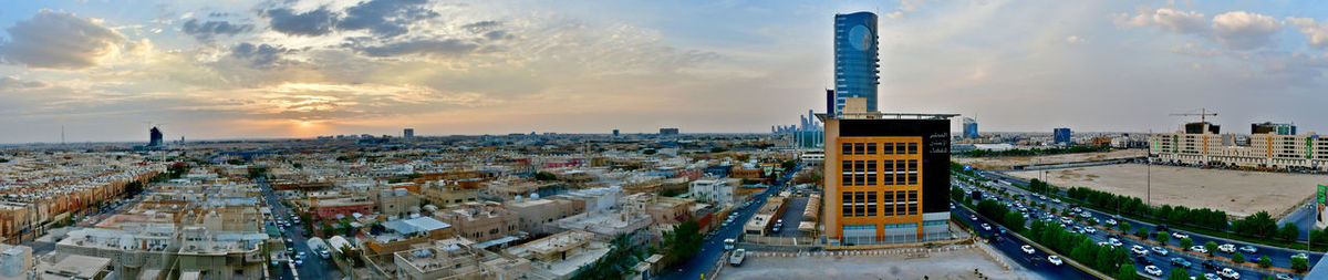 Panoramic view of buildings against sky during sunset