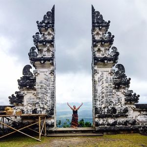 Low angle view of statue against cloudy sky