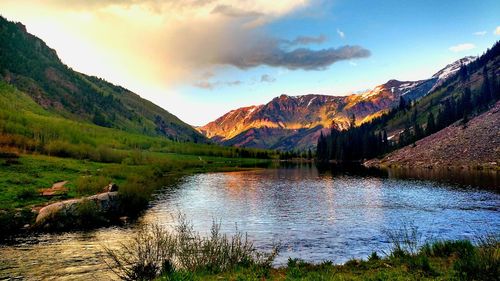 Scenic view of mountain range against cloudy sky