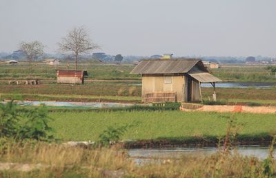 House on field against sky