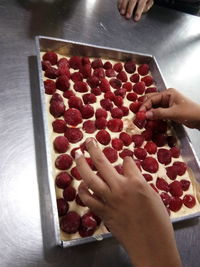 High angle view of woman preparing food on table