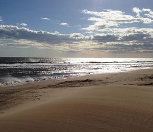 Scenic view of beach against sky