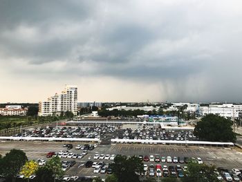 High angle view of cityscape against cloudy sky