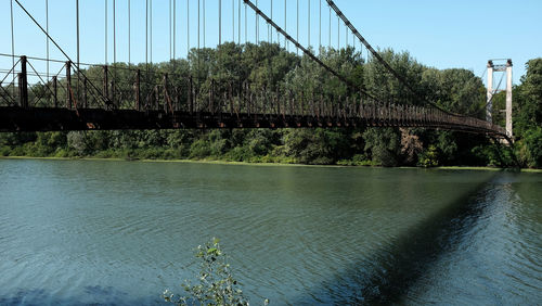 Bridge over river against sky