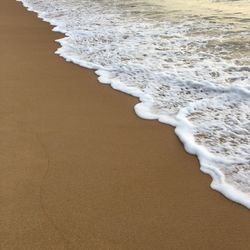 High angle view of surf on beach