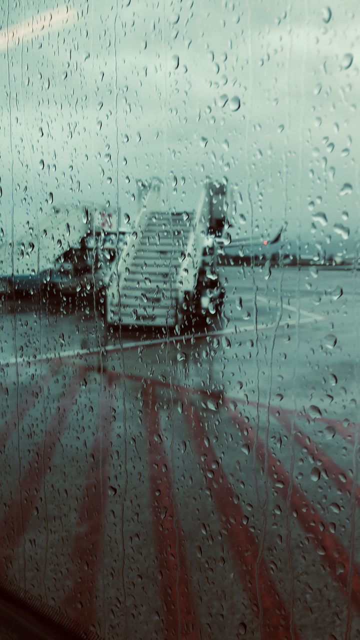 FULL FRAME SHOT OF WET WINDOW IN RAINY SEASON