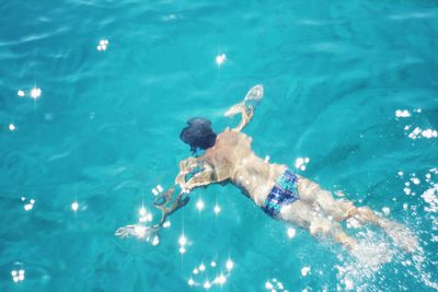 Man swimming in pool