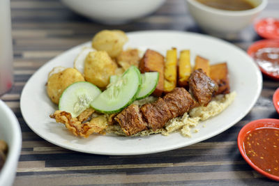 Close-up of meal served on table
