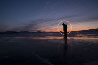 Fire over baikal lake at sunrise