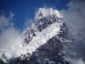 Scenic view of snow mountains against sky