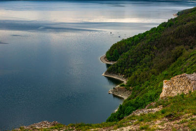 Scenic view of sea and mountains against sky