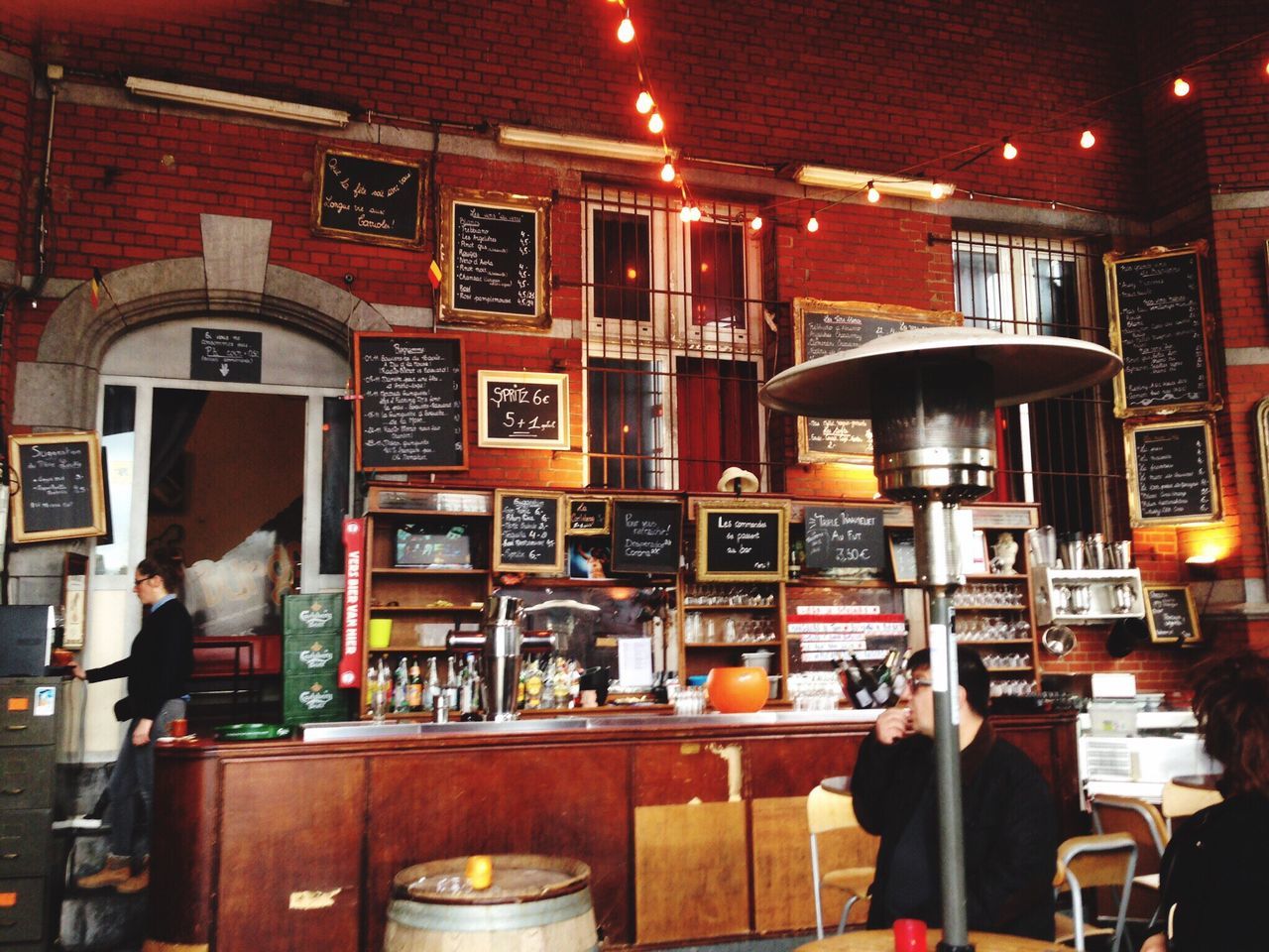 WOMAN STANDING IN RESTAURANT