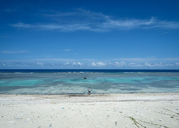 Scenic view of sea against blue sky