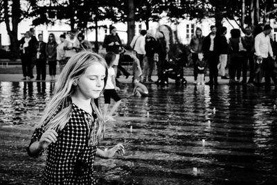 Girl walking by fountain