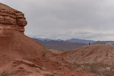 Scenic view of landscape and rock formation against sky