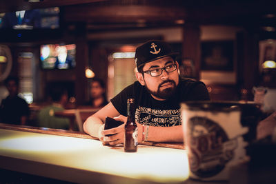 Portrait of mid adult man sitting in restaurant