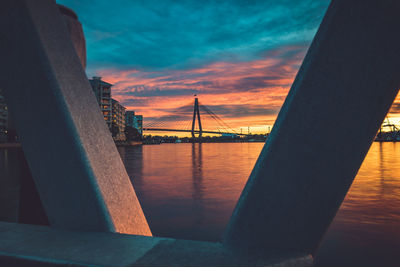 View of suspension bridge against cloudy sky