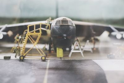 Close-up of airplane on floor in city