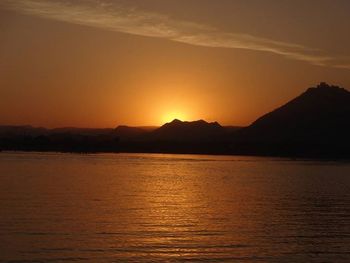 Scenic view of sunset over mountains