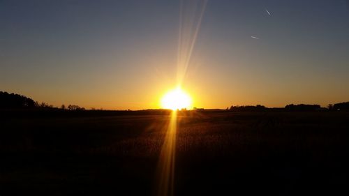 Sun shining through landscape