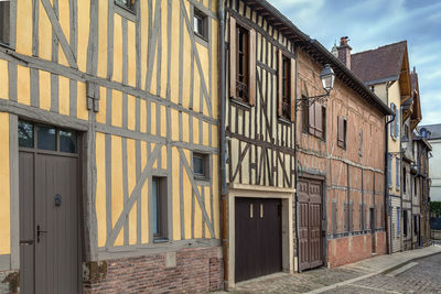 Street with historical half-timbered houses in troyes, france