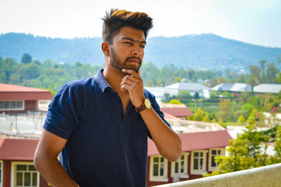 Portrait of young man looking away