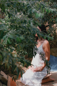 High angle view of woman standing amidst plants