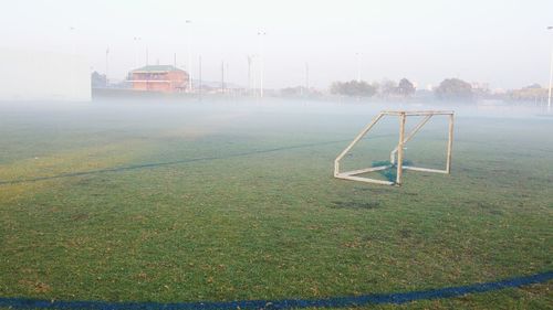 View of grassy field against sky