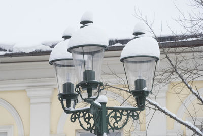 Rear view of man on bicycle in winter