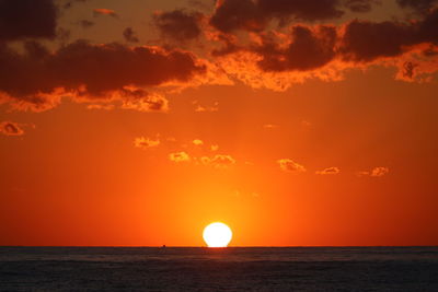 Scenic view of sea against romantic sky at sunset