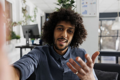 Portrait of young man using mobile phone